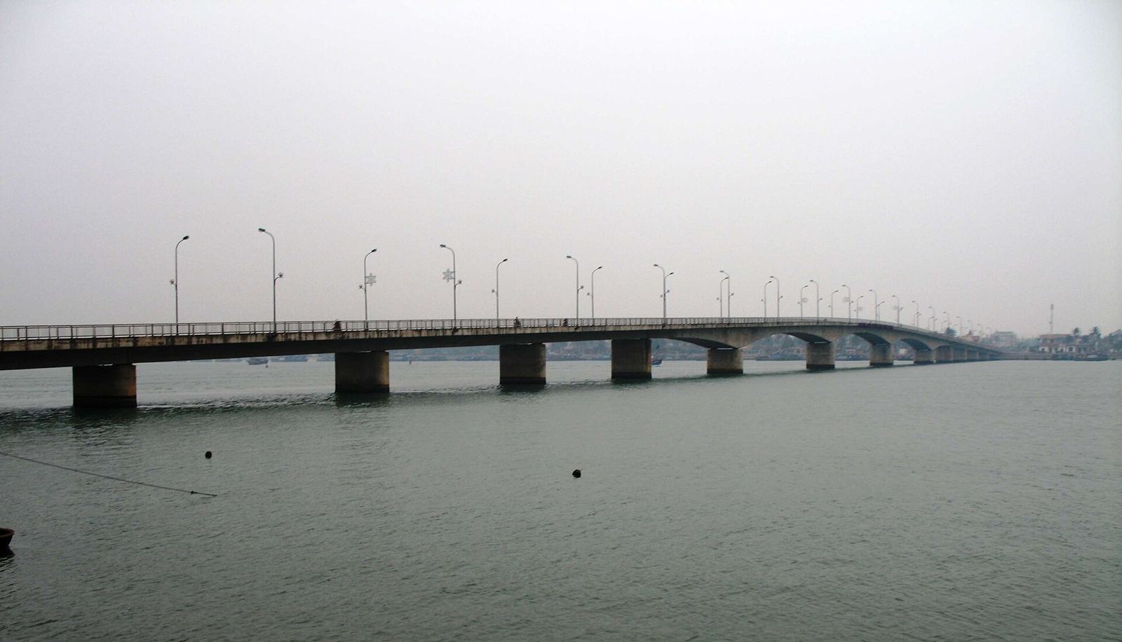Nhật Lệ Bridge, with the river opening towards the coast.